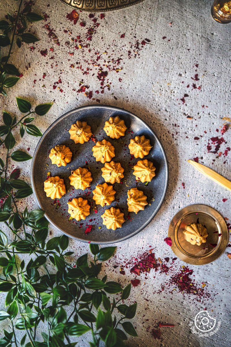 overhead photo of a plate of Dulce De Leche Modaks on a table with a plant on the side