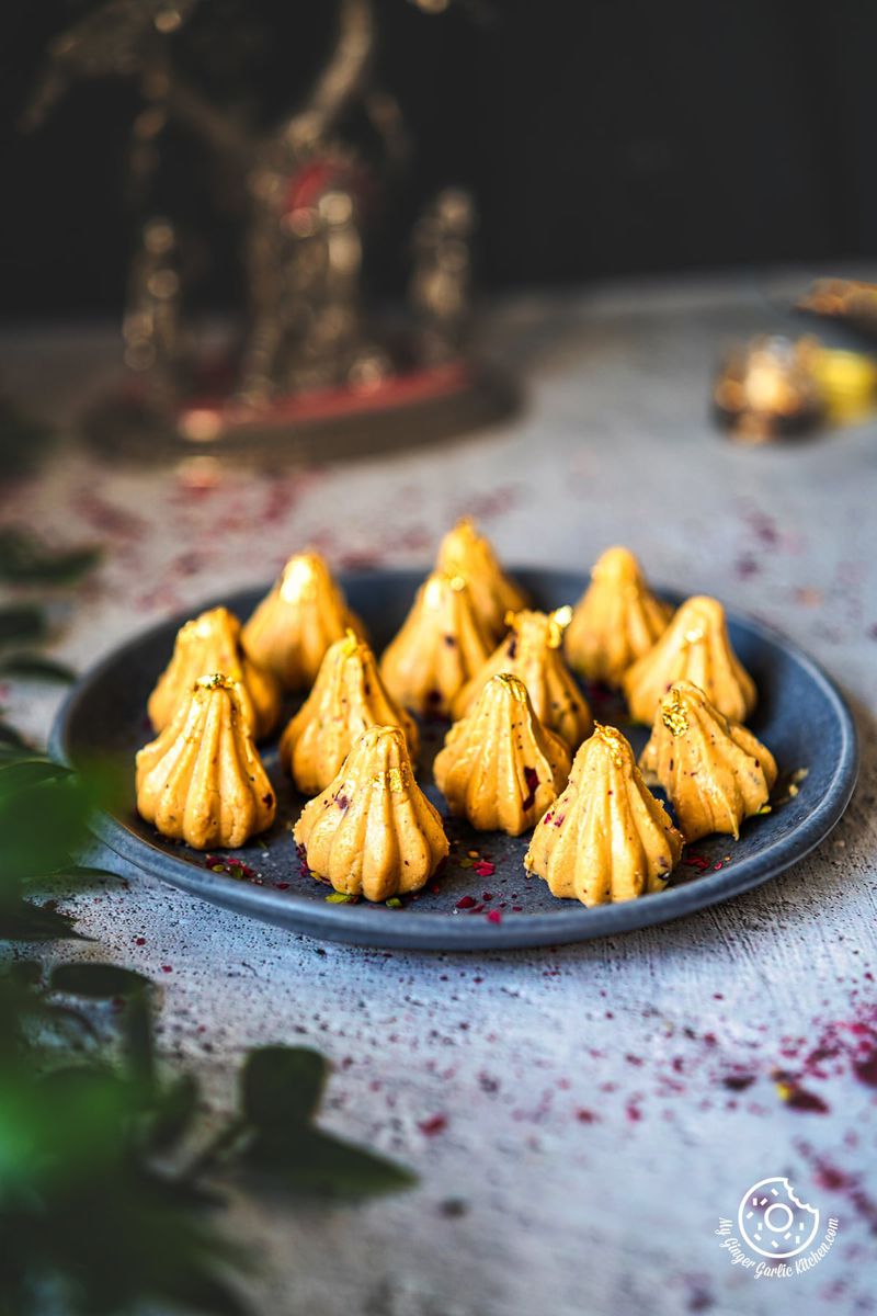photo of a plate of yellow Dulce De Leche Modak on a table