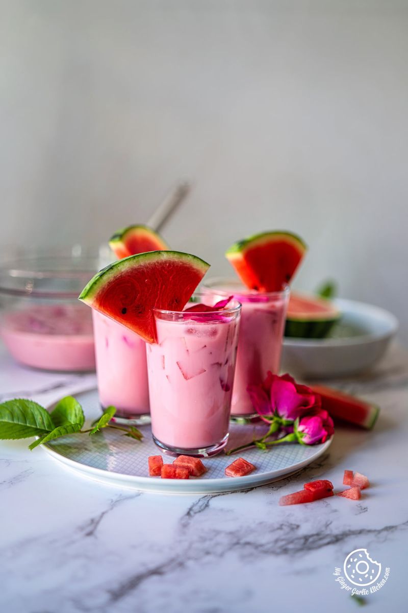 3 glasses with mohabbat ka sharbat in a grey ceramic plate