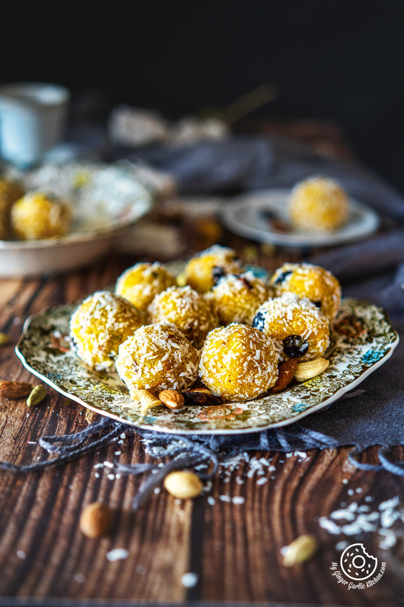 nine pineapple ladoos on a floral plate