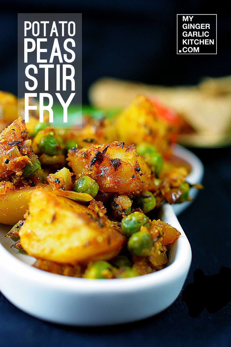 there is a white bowl filled with aloo matar dry