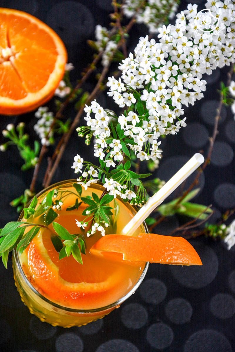 a glass of virgin ginger mimosa with a straw