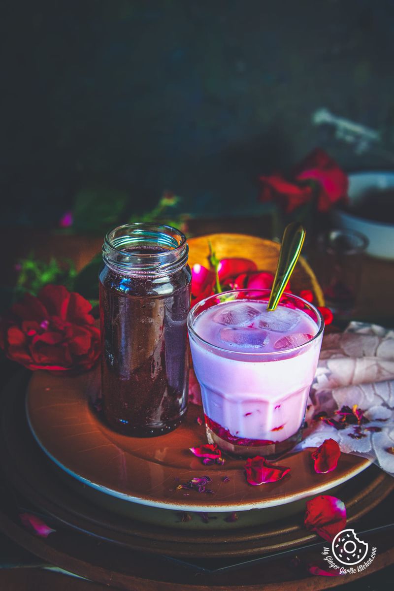 rose syrup in a glass bottle and rose milk in a glass
